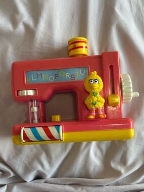 Vintage Sesame Street Big Bird toy sewing machine